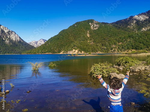 child on the lake