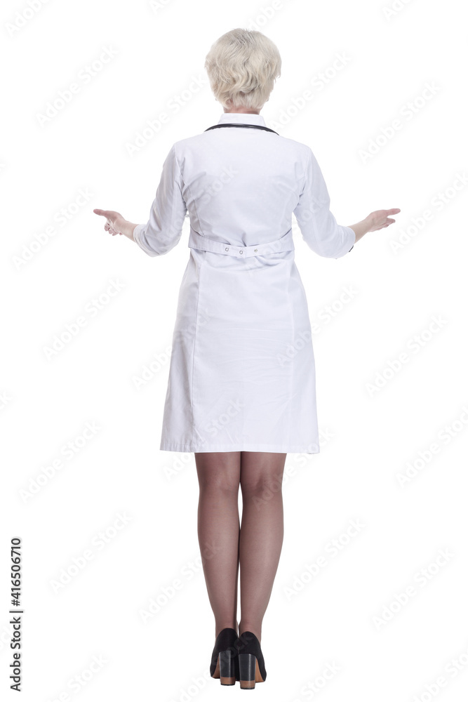 young woman doctor reading an ad on a white screen . young woman doctor reading an ad on a white screen .