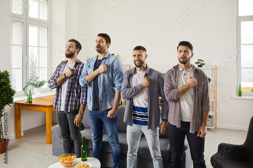Obraz na plátne Group of young men supporting favourite football team