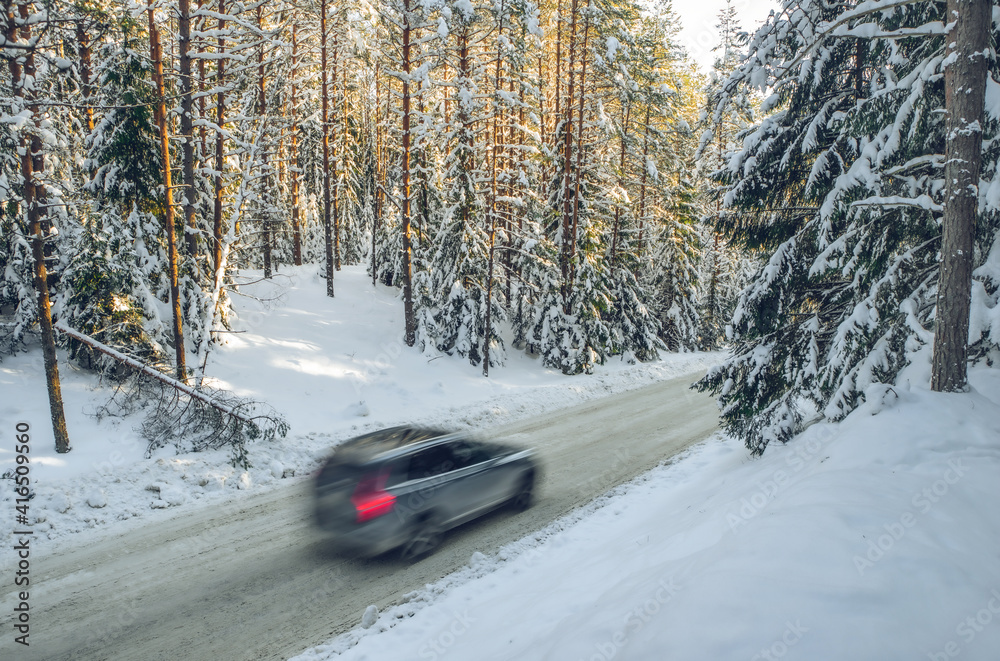 Scenic landscape of winter forest. Trees covered by snow. Car on road. Scenic landscape of winter forest. Trees covered by snow. Car on road.