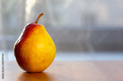 Juicy flavorful pear on wooden table