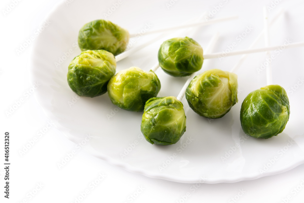 Fototapeta premium Set of brussel sprouts with lollipop sticks isolated on white background