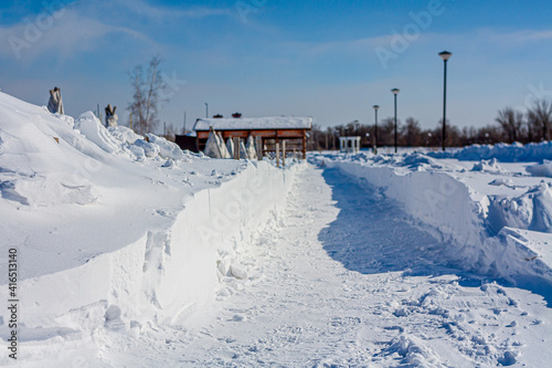 Snow-covered roads and sidewalks in the city center. Snow removal. Soft Focus