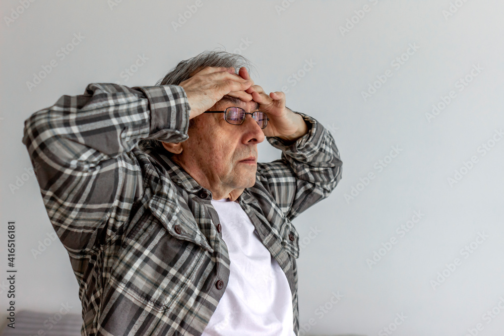 Cropped shot of a senior man suffering with a migraine. Close up aged man with headache. Shot of a handsome senior man suffering with a headache at home. Pain, stress and people concept. Copy space. Cropped shot of a senior man suffering with a migraine. Close up aged man with headache. Shot of a handsome senior man suffering with a headache at home. Pain, stress and people concept. Copy space.