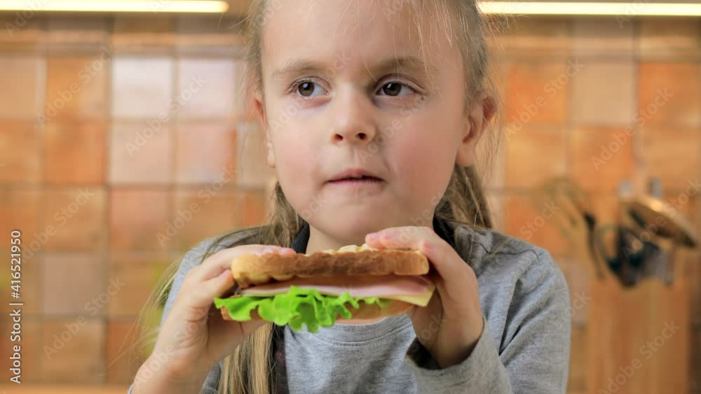 Little girl eating homemade sandwich Little girl eating homemade sandwich