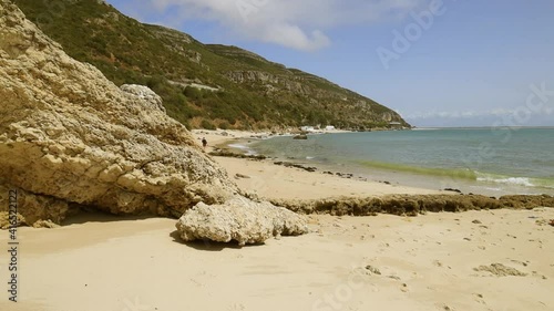 Tourists Walking At The Famous Galapinhos Beach In Arrabida Natural Park, Portugal. wide shot photo