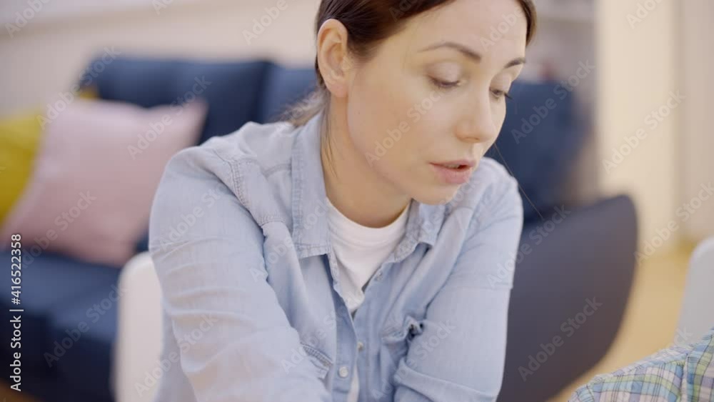 Upset mom doing homework with lazy son, problem of parenting, distance education Upset mom doing homework with lazy son, problem of parenting, distance education