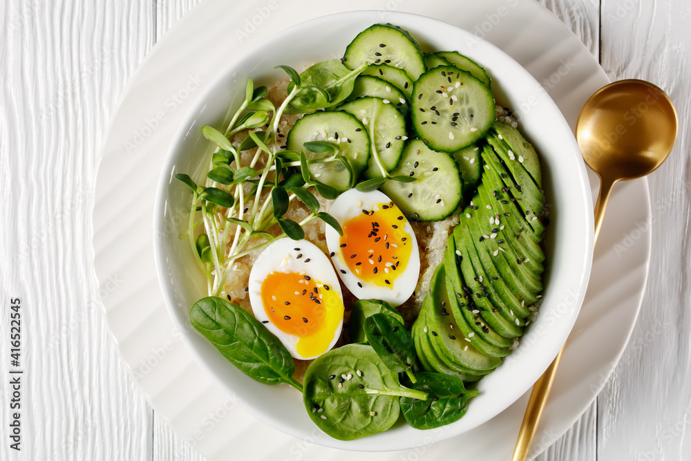 bowl with quinoa, greens, avocado and boiled egg bowl with quinoa, greens, avocado and boiled egg