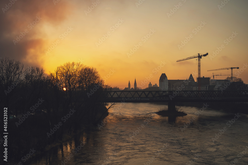 yellow sunset on the danube river in ingolstadt