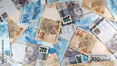 various money notes of 50 reais 100 reais and 200 reais from brazil. money from brazil. earn money. Real, Currency, Money, Dinheiro, Reais, Brasil. photo