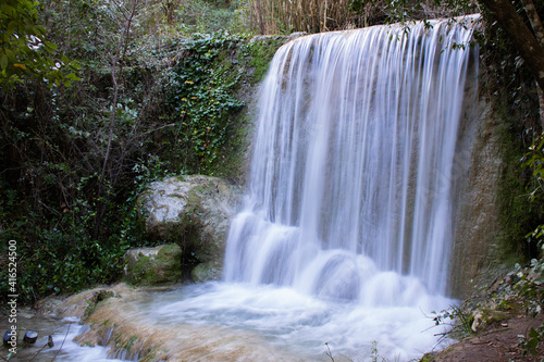 Long exposure of small cascade in nature. Quiaios Waterfall in Portugal  also known as Cascata de Quiaios near Figueira da Foz  a peaceful natural hidden place in the woods