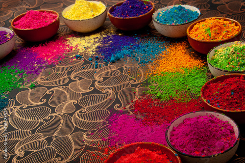 Happy Holi top view of colorful holi colors in bowls with Splash, Concept Indian color festival.  photo