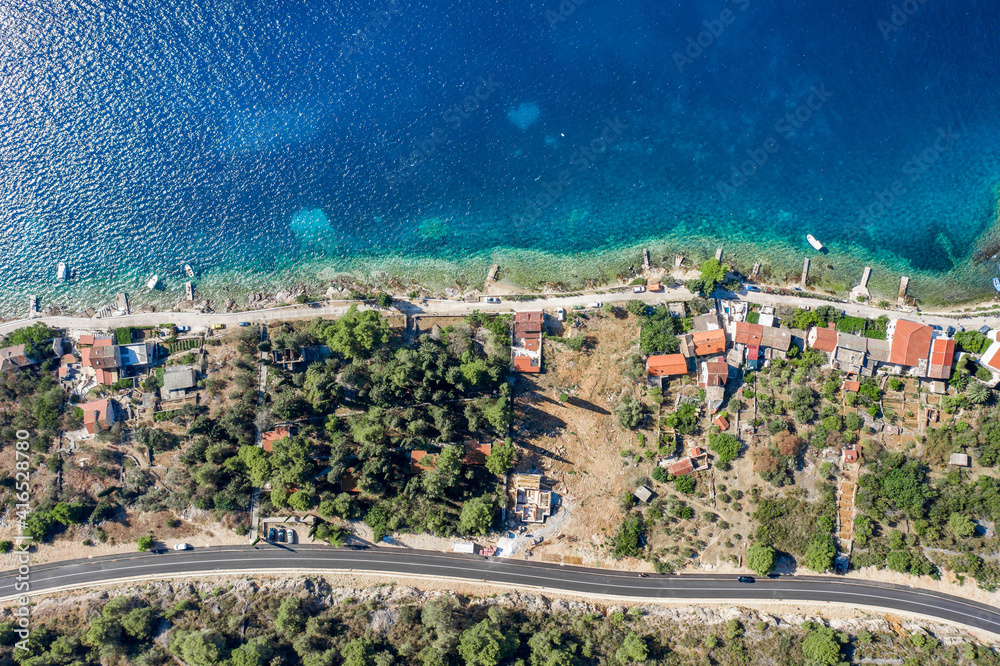 Aerial overhead drone shot of yachts on Adriatic sea near Vis Island in Croatia summer