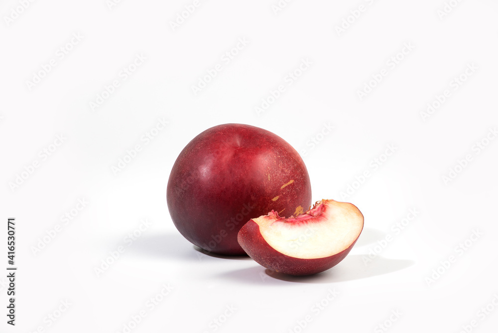 Ripe whole nectarine peach fruit with half and slice isolated on white background. Peaches with clipping path Ripe whole nectarine peach fruit with half and slice isolated on white background. Peaches with clipping path