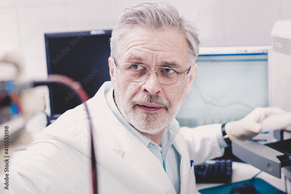 Life science researcher performing a genotyping testing which enables personalized medicine. PM is a medical model that proposes the customization of healthcare. Life science researcher performing a genotyping testing which enables personalized medicine. PM is a medical model that proposes the customization of healthcare.