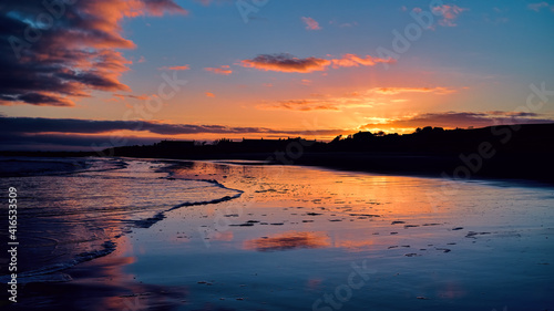 Winter golden sunset on Brora beach in the Highlands with reflections in the wet sand © HighlandBrochs.com