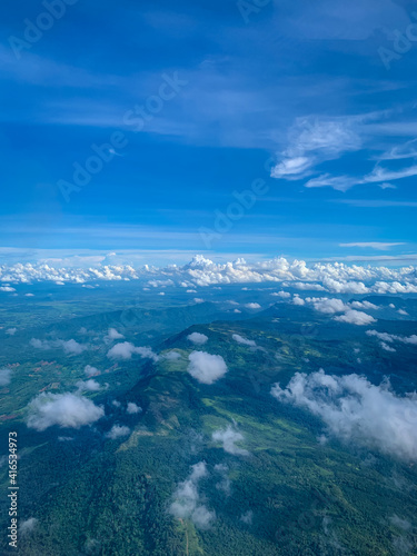 mountain ridge with blue sky from aerial view