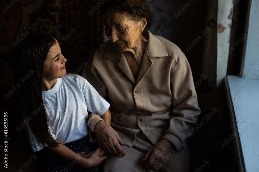 portrait of a great-grandmother, great-granddaughter, close-up portrait of a great-grandmother, great-granddaughter, close-up