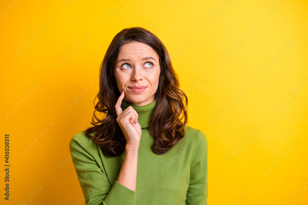 Portrait of young thoughtful minded beautiful woman thinking look copyspace isolated on yellow color background Portrait of young thoughtful minded beautiful woman thinking look copyspace isolated on yellow color background