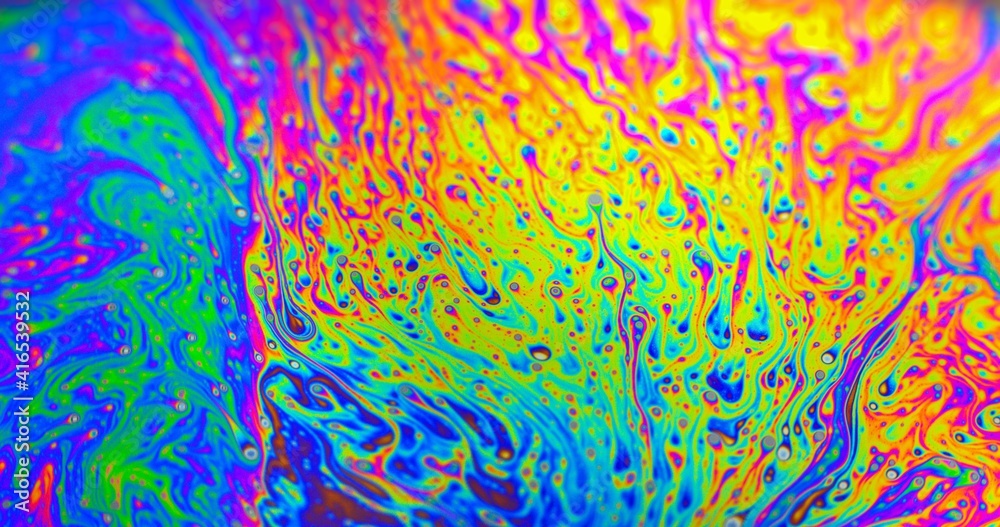 Smooth colorful liquid flowing as background texture