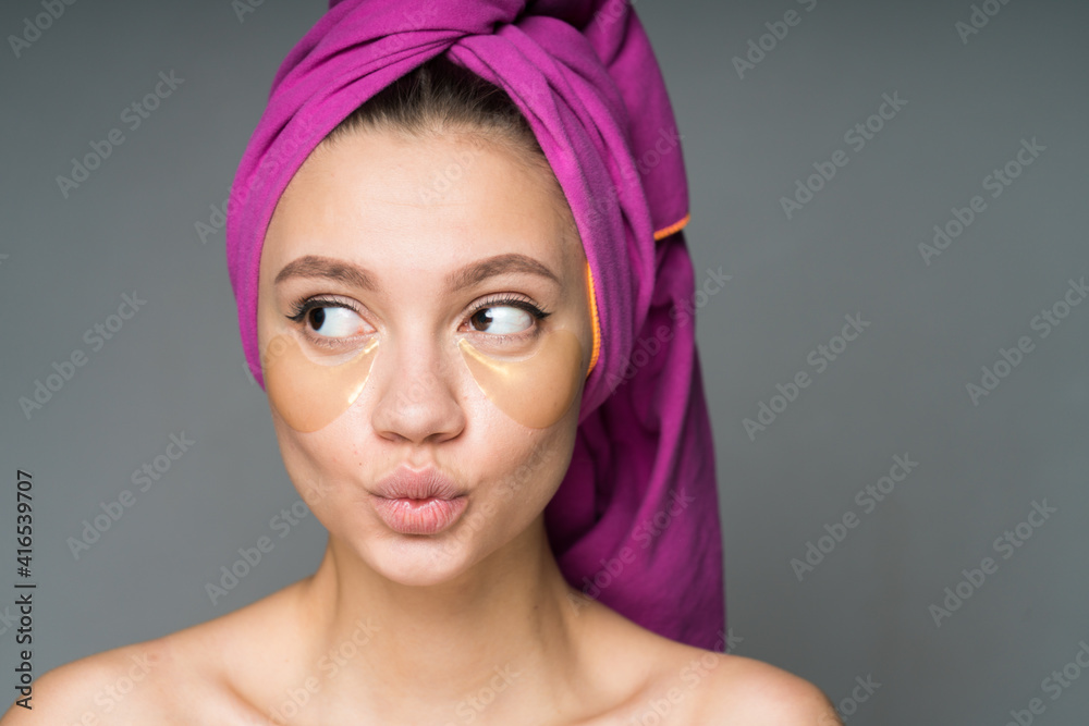 girl with patches under her eyes made her lips tube and sleaped her eyes to the side staring at someone. High quality photo girl with patches under her eyes made her lips tube and sleaped her eyes to the side staring at someone. High quality photo