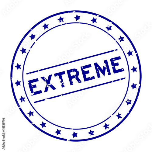 Grunge blue extreme word round rubber seal stamp on white background