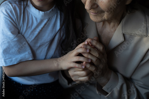 portrait of a great-grandmother, great-granddaughter, close-up © Angelov