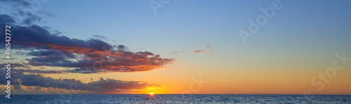 Sunset sky panorama on Hawaii with a lot of copy space for text on the sky. © thecolorpixels