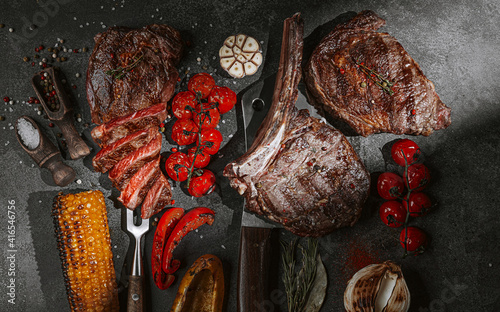 grilled beef steak on a dark background. expensive marbled beef of the highest grade fried to rare on the grill