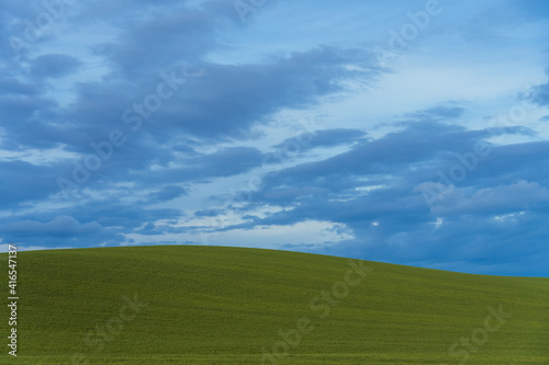 Rural landscape against blue sky.
