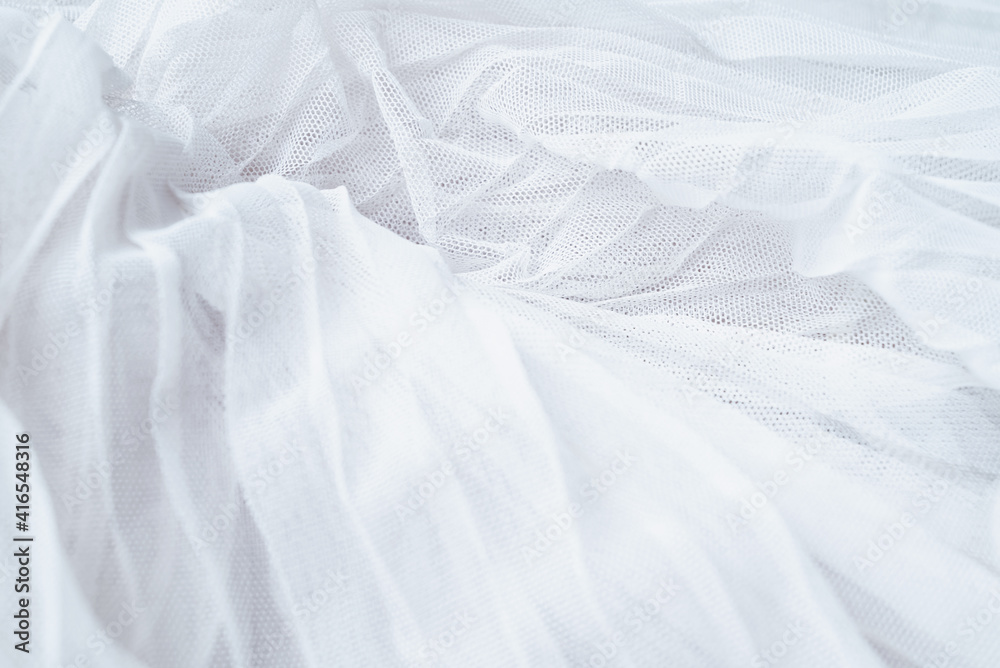 Obraz premium White colored tulle fabric texture. Textile background