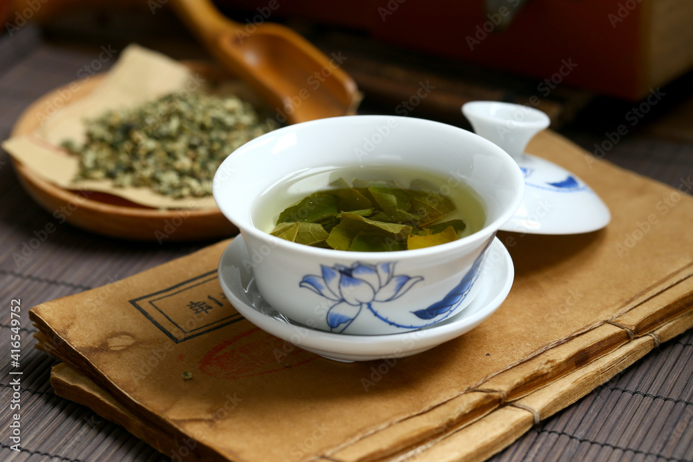 Lotus leaf tea in blue and white porcelain covered bowl Lotus leaf tea in blue and white porcelain covered bowl