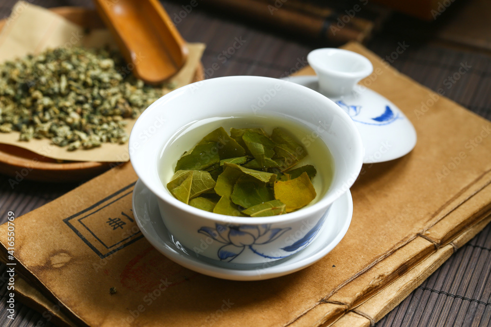 Lotus leaf tea in blue and white porcelain covered bowl Lotus leaf tea in blue and white porcelain covered bowl
