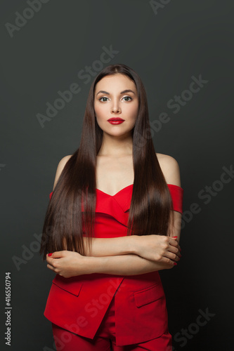 Fashion model woman with shiny hair on black background