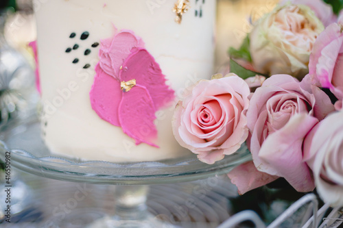 Small wedding cake with pink floral frosting