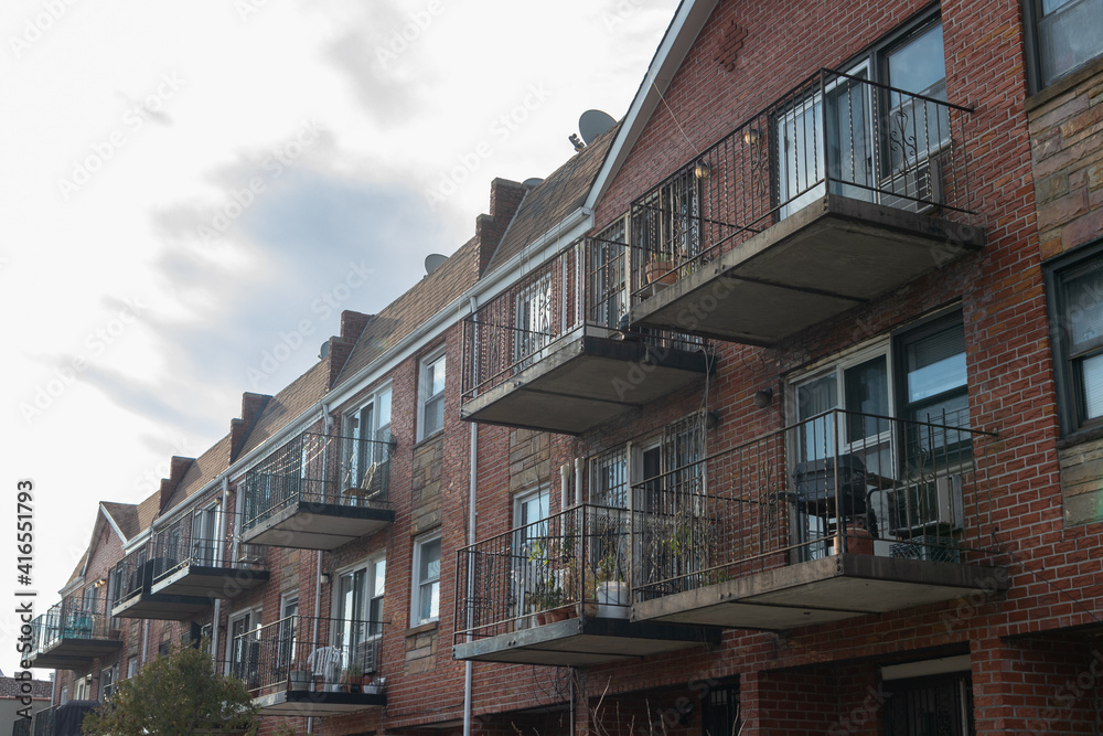 Row of Generic Brick Apartment Buildings with Balconies in Astoria Queens New York