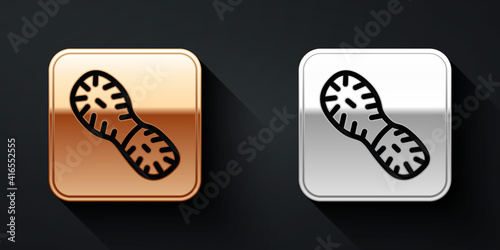Gold and silver Human footprints shoes icon isolated on black background. Shoes sole. Long shadow style. Vector.