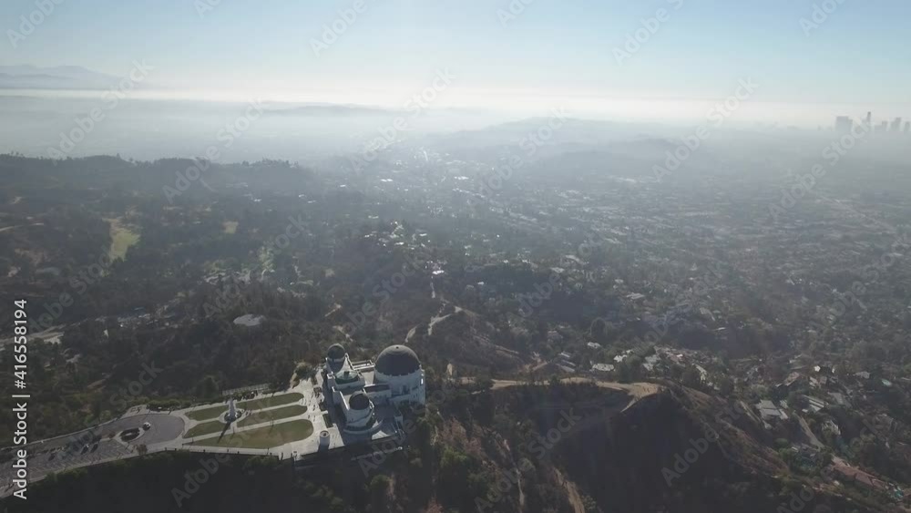Drone ascending over Griffith Observatory, Los Angeles, USA Drone ascending over Griffith Observatory, Los Angeles, USA