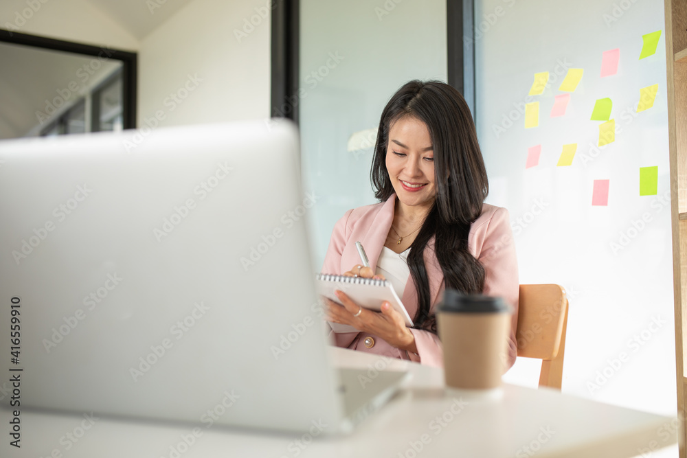 Portrait of Asian woman using computer laptop innovative ideas, in video call conference meetings and work from home. Portrait of Asian woman using computer laptop innovative ideas, in video call conference meetings and work from home.