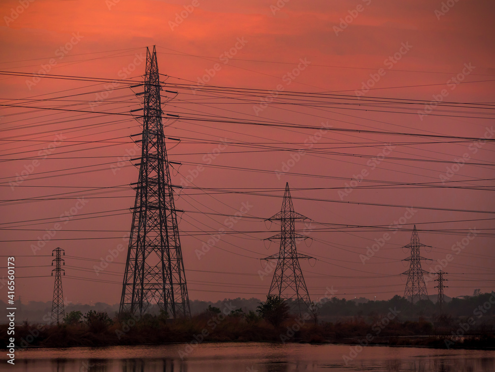 High-voltage power lines at sunset/Sunrise