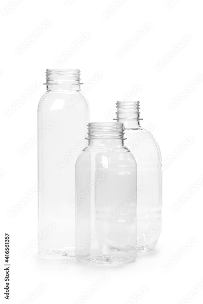 three different empty plastic bottles isolated on white background. production of new containers three different empty plastic bottles isolated on white background. production of new containers