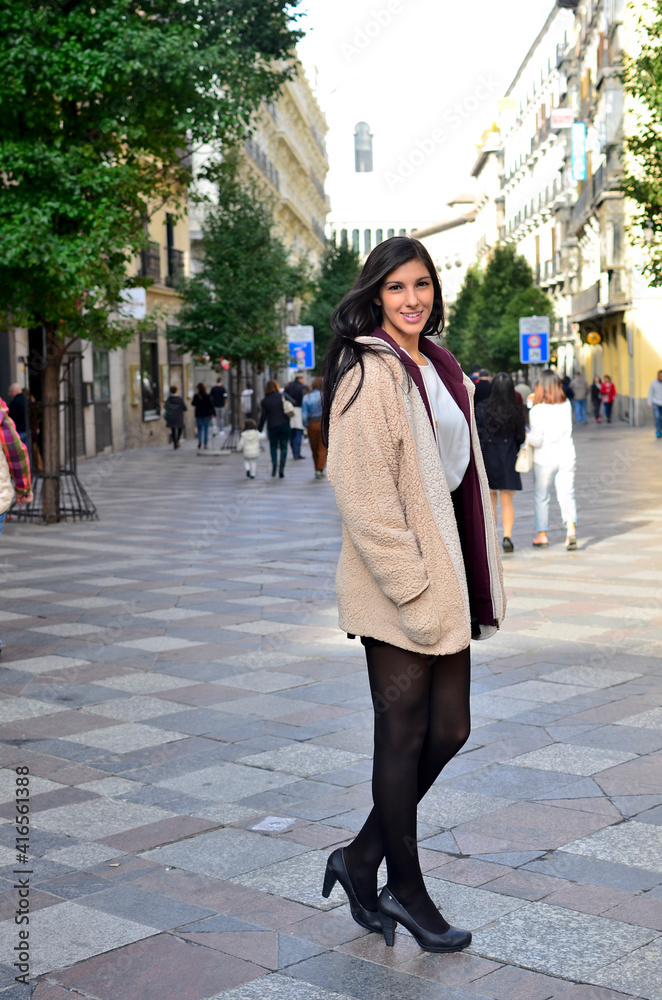 Pretty Woman with radiant smile in the city
