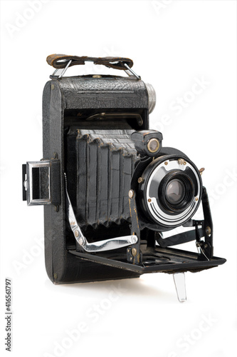 ancient folding camera on white background