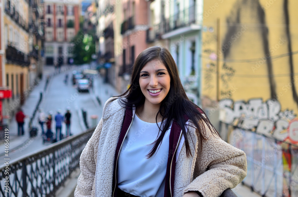 Fototapeta premium Pretty Woman with radiant smile in the city