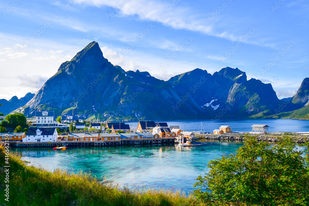 Beautiful scenic of the small island Sakrisoy which is situated at the foot of Olstind, one of Lofoten's most iconic mountains. Famous destination in North of Norway.