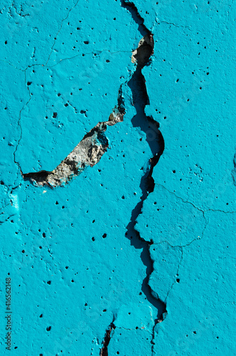 concrete wall with crack blue paint