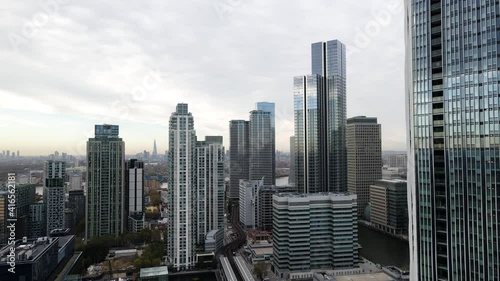 Wallpaper Mural Cinematic aerial shot of futuristic and modern mirrored skyscraper buildings in London during sunrise in background. Slow trucking shot. London,United Kingdom. Torontodigital.ca