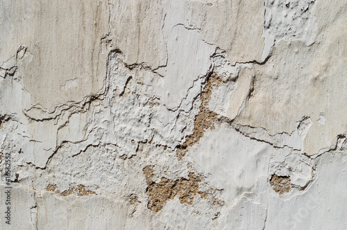 old wall, white paint, to peel, several layers