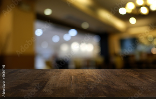 Wood Table Top in Blur Background room interior with empty copy space.