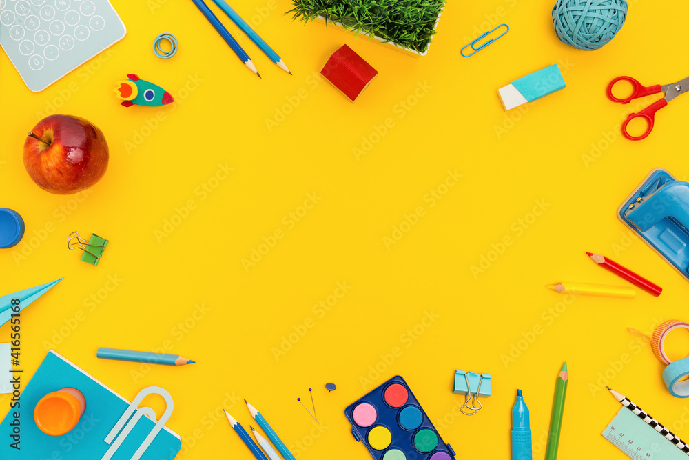 School supplies and yellow background. Back to school.
School supplies and yellow background. Back to school.